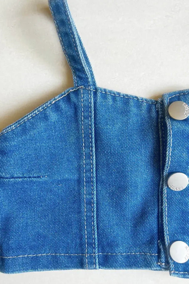 Close up of top of a Girls' Sleeveless Denim Top and Pants Set.