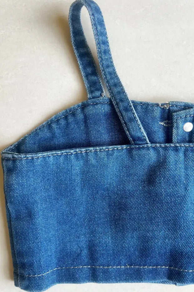 Close up of top of a Girls' Sleeveless Denim Top and Pants Set.