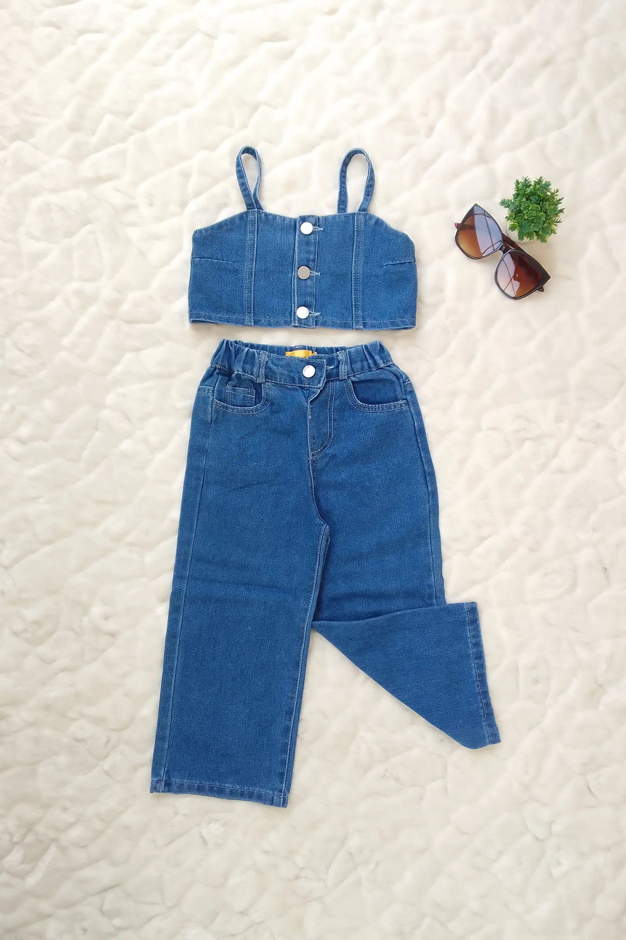 Flat full view of a Girls' Sleeveless Denim Top and Pants Set.