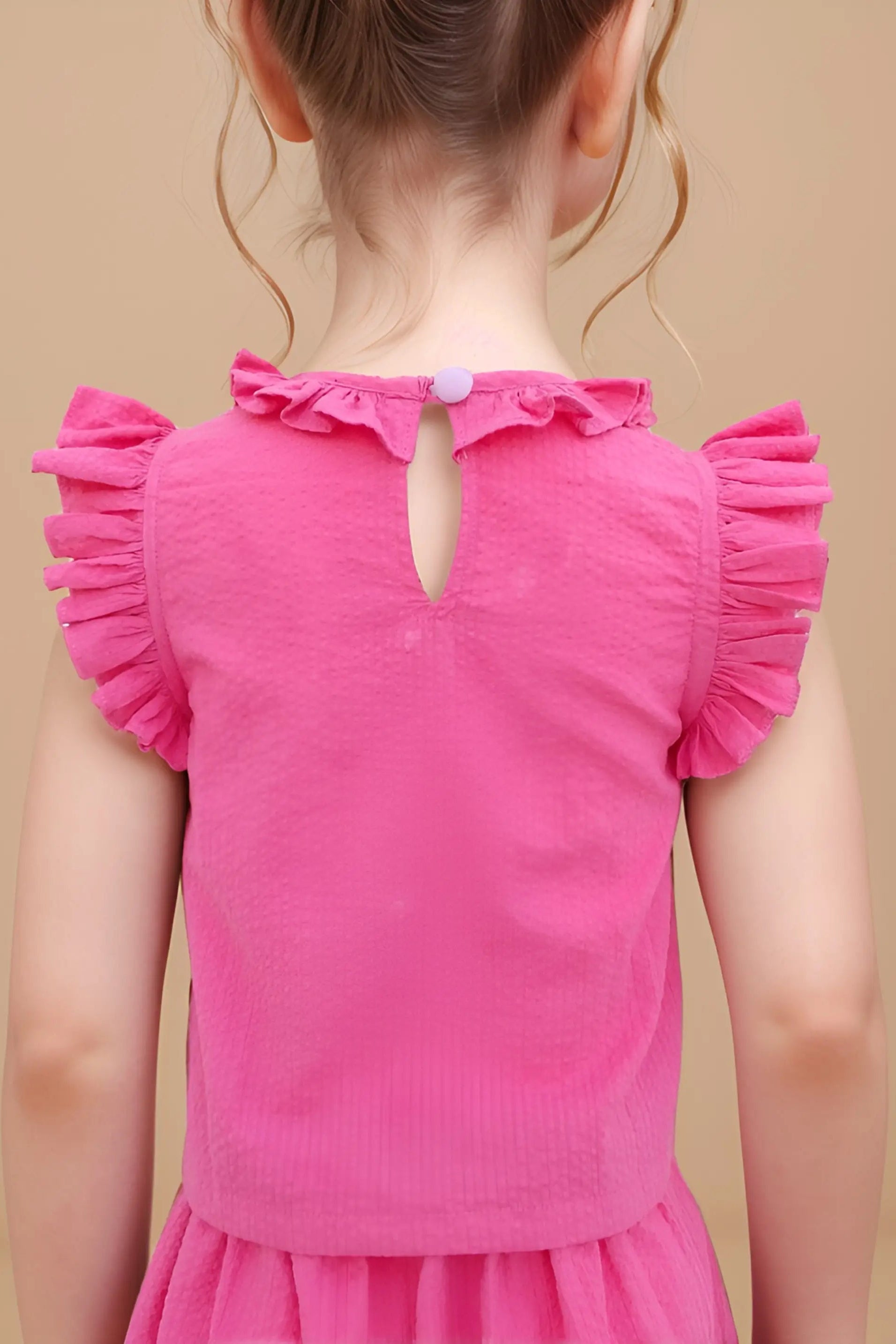 Back close up of girls self designed frill top with skort