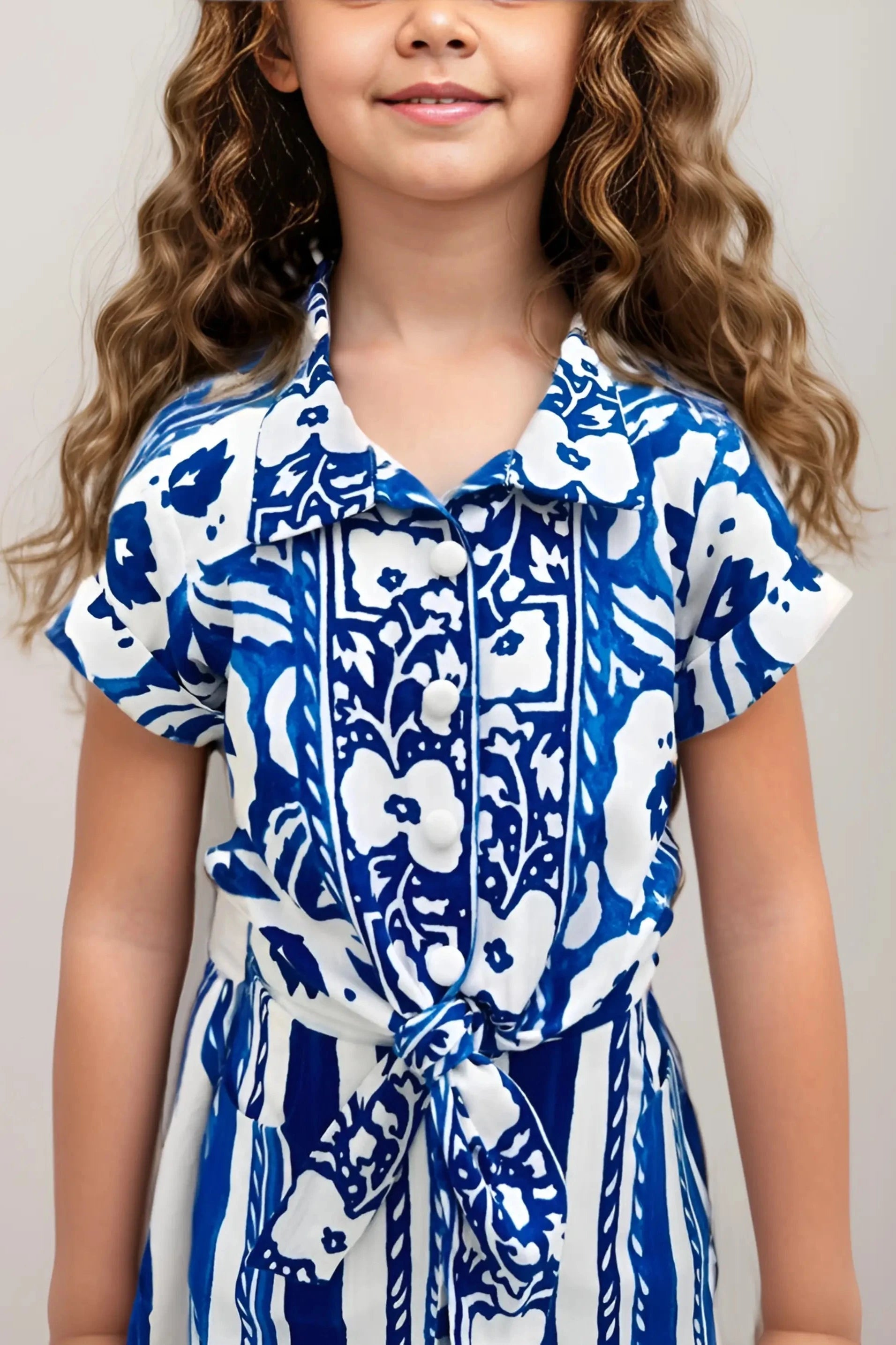 Front close up view of a Girls' Floral Printed Linen Shirt & Shorts Set.