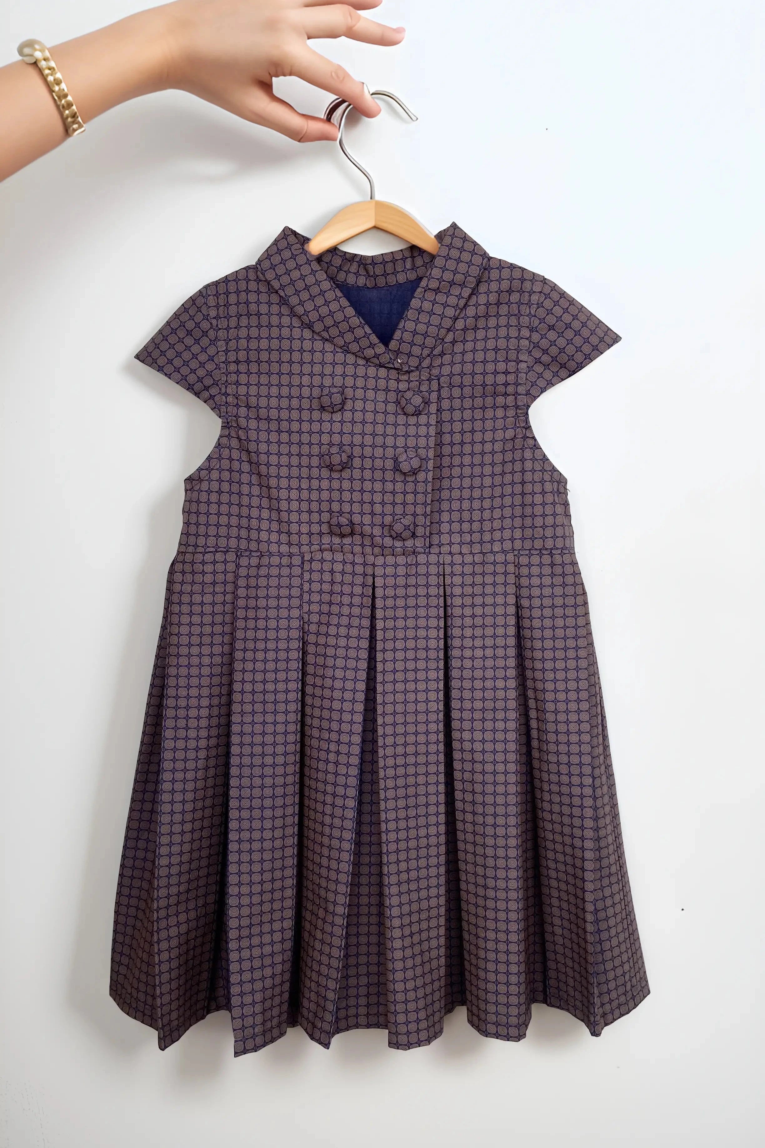 Flat front of a Brown Checked Cotton Dress for Girls.