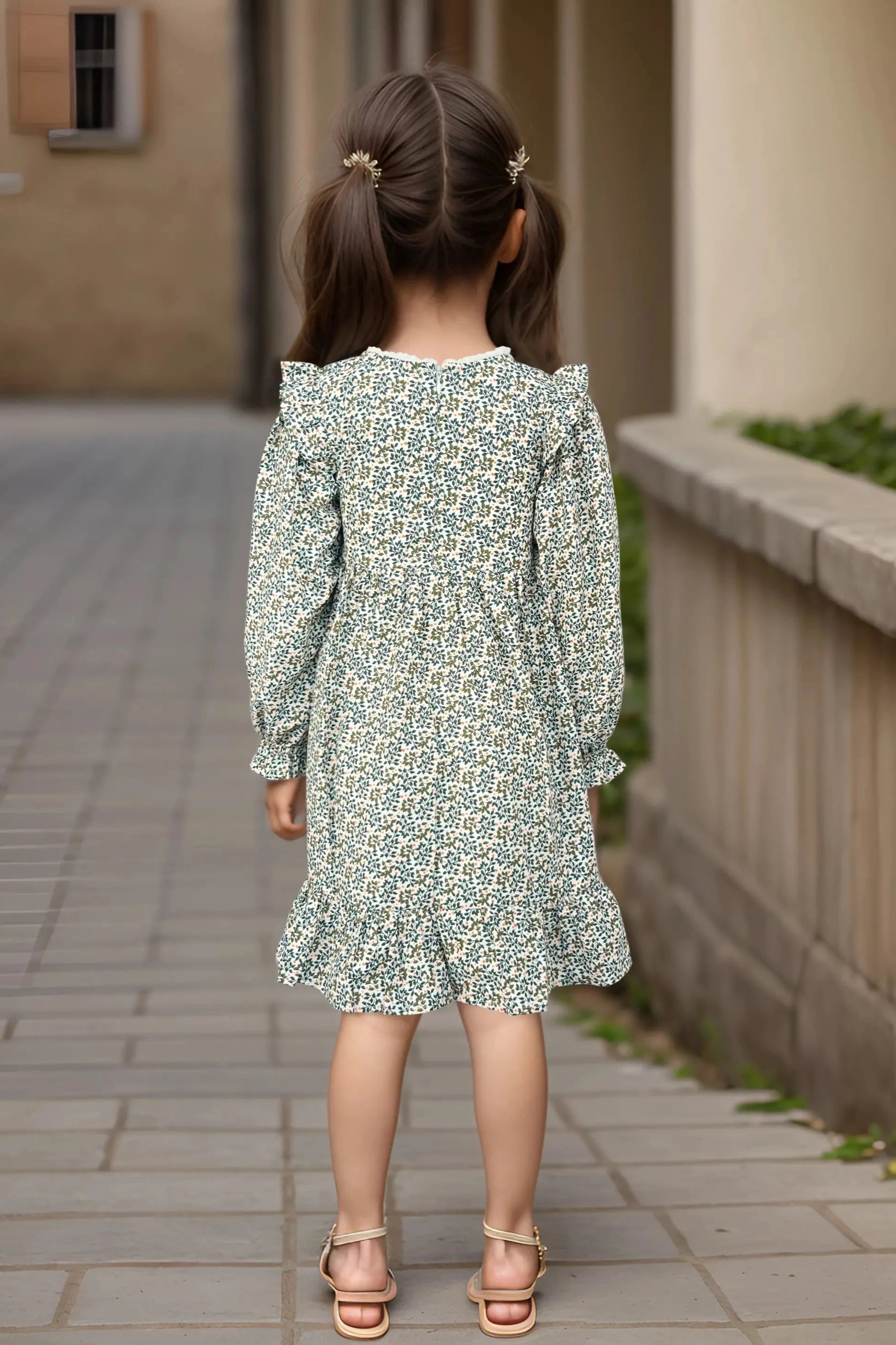 Back full view of a green dress for  baby girl, designed for kids aged 2 to 9 years old.