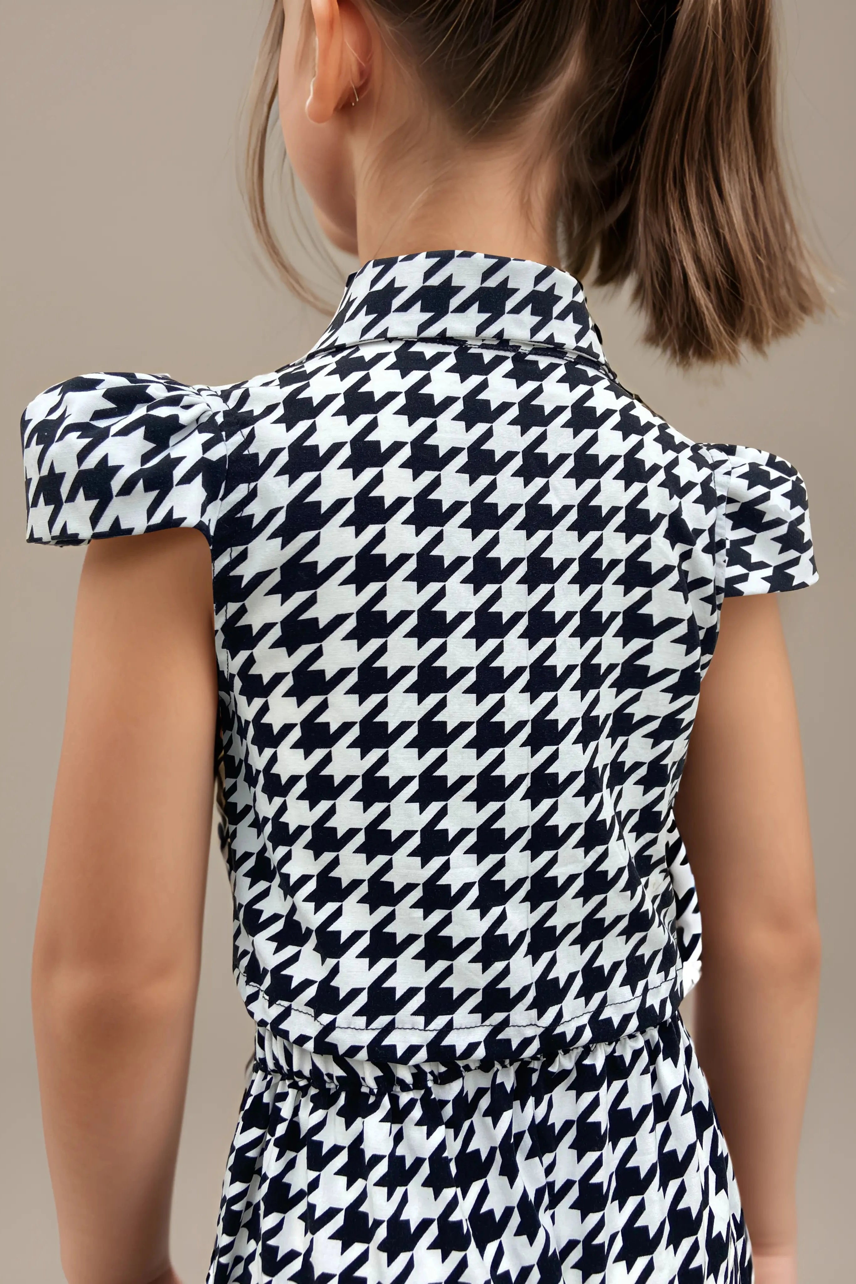 Back side view close up of trendy houndstooth co-ord set for girls.