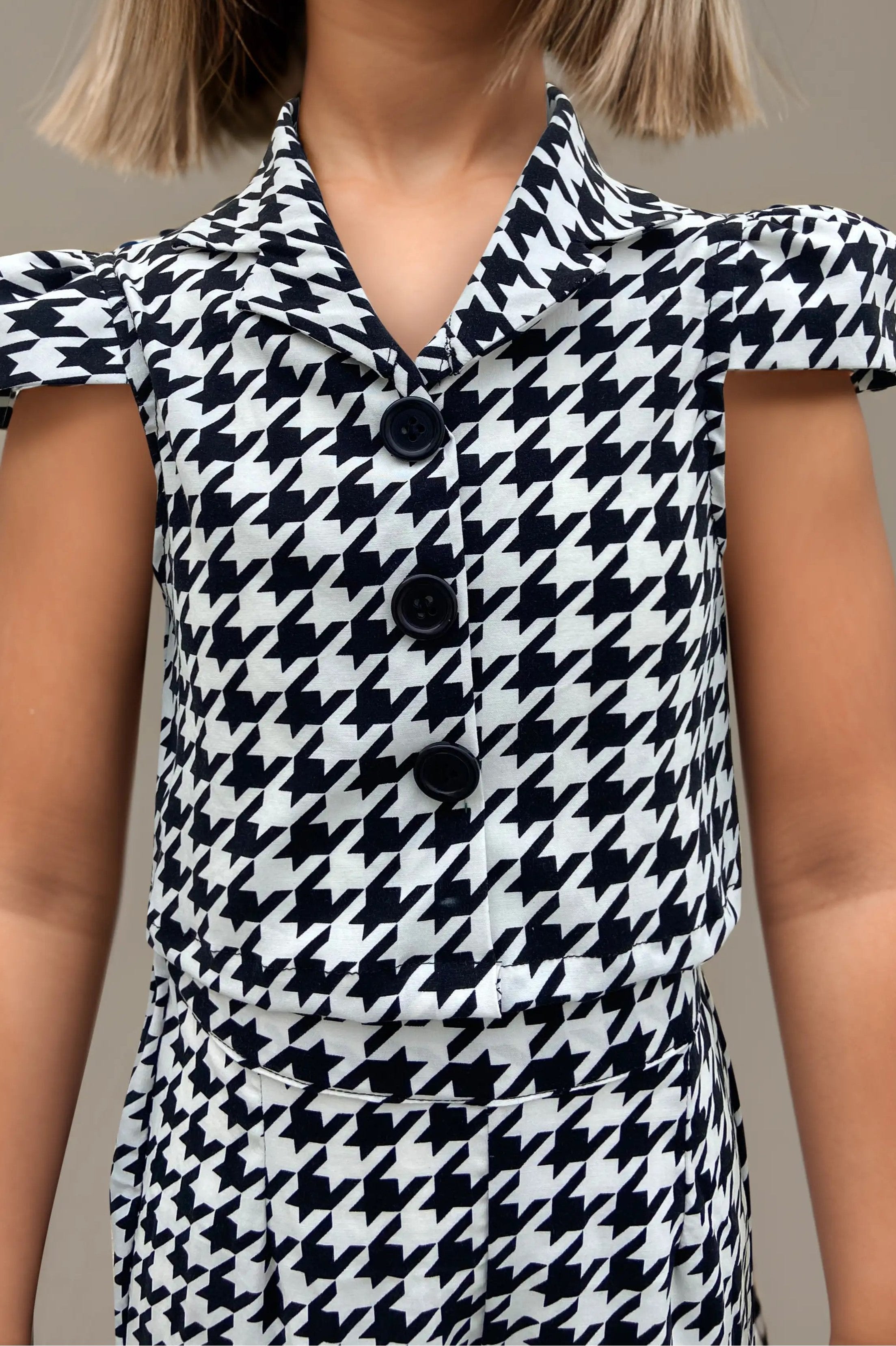 Front close up view of trendy houndstooth co-ord set for girls.