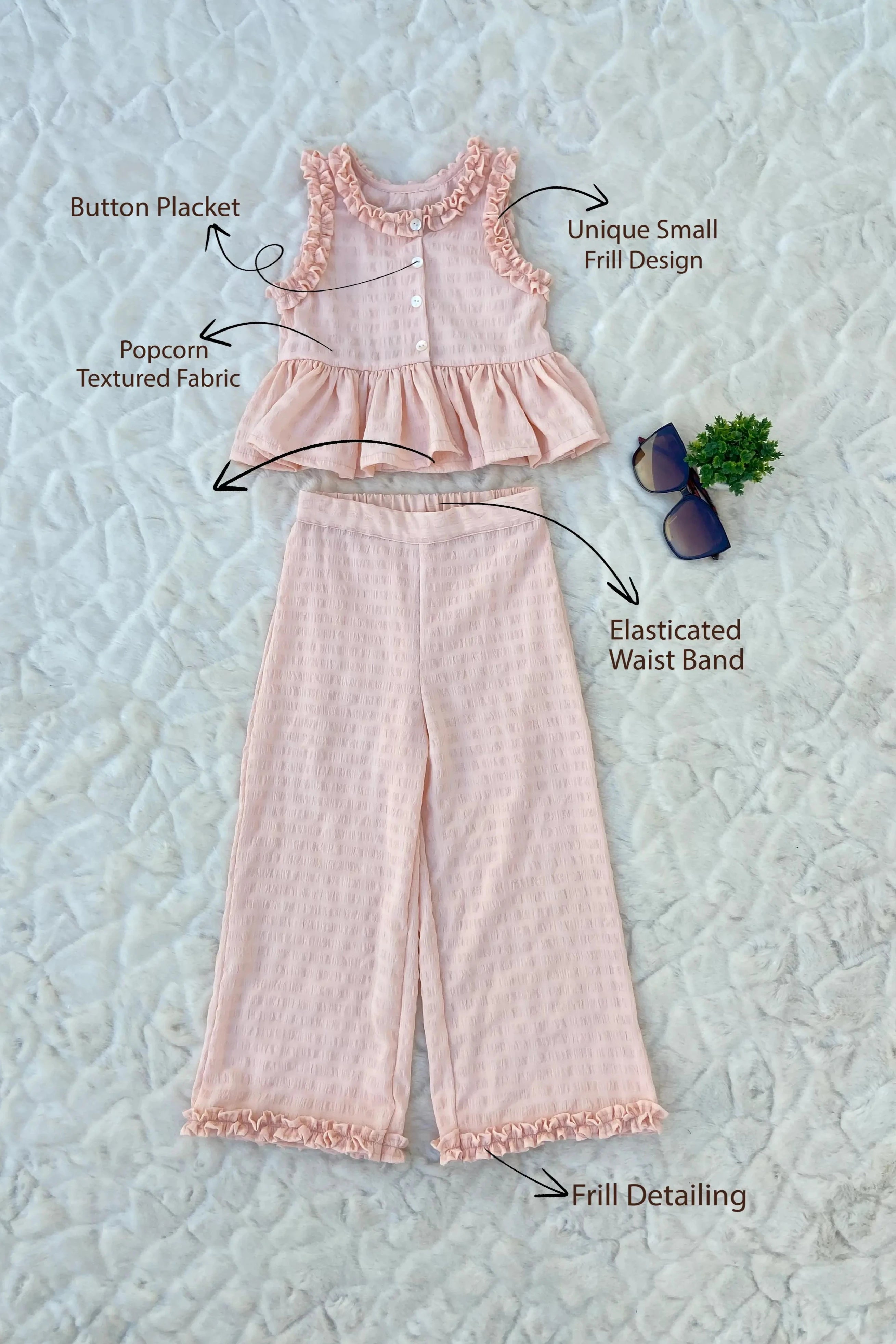 Flat view of a Peach Ruffled Top and Pant Set for Kids.