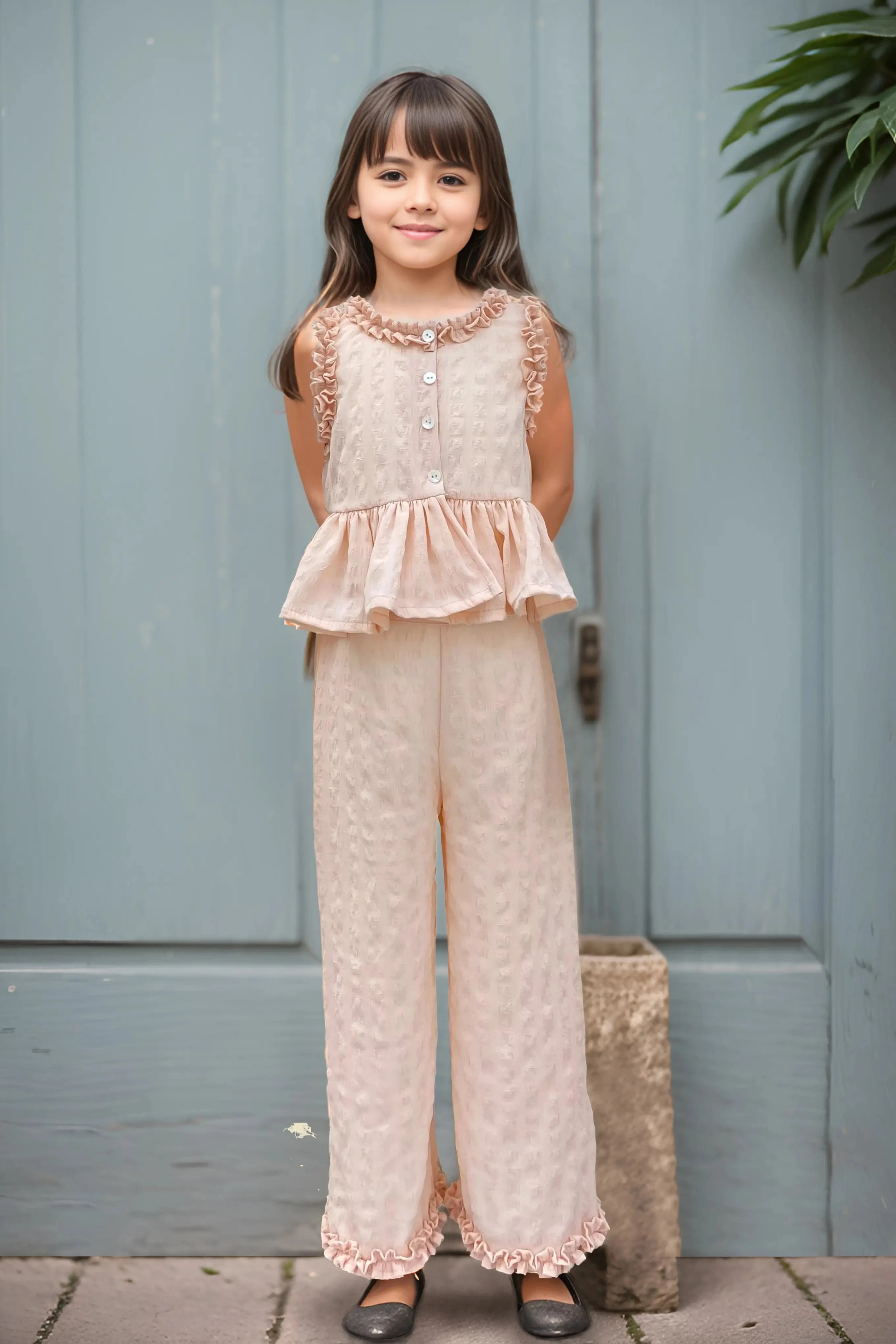 Front full view of a Peach Ruffled Top and Pant Set for Kids.