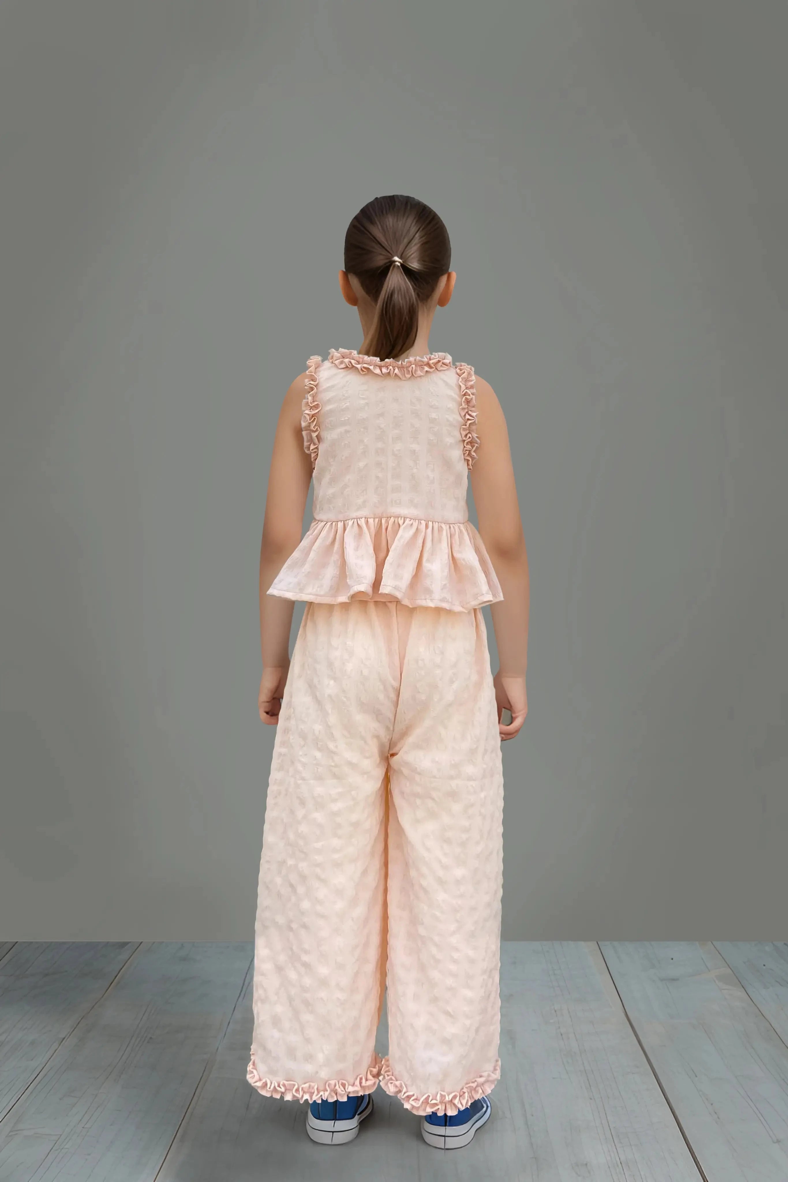 Full back view of a Peach Ruffled Top and Pant Set for Kids.