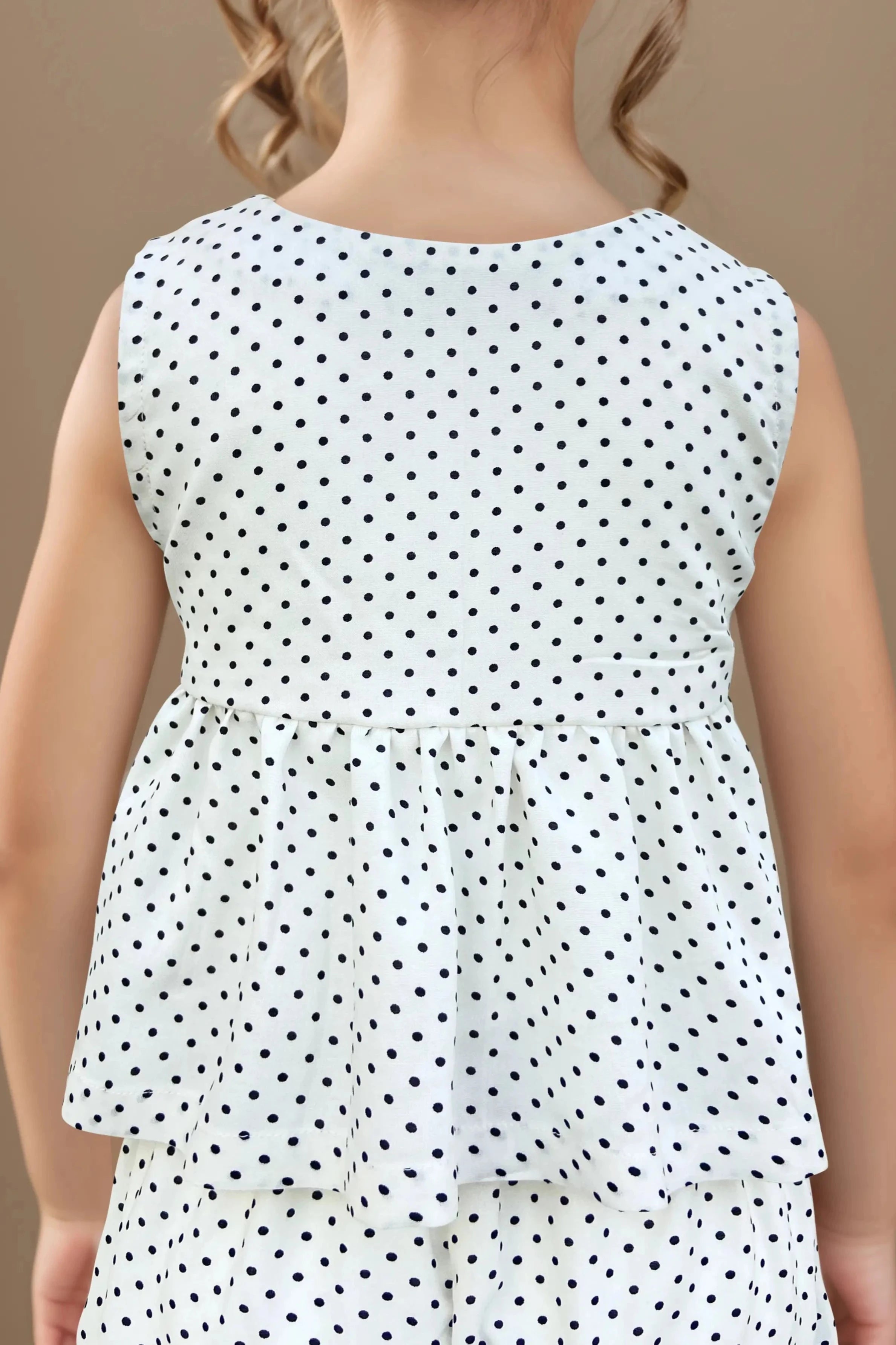 Back close up of a polka Dot Flared Top and Pants Set for Girls.